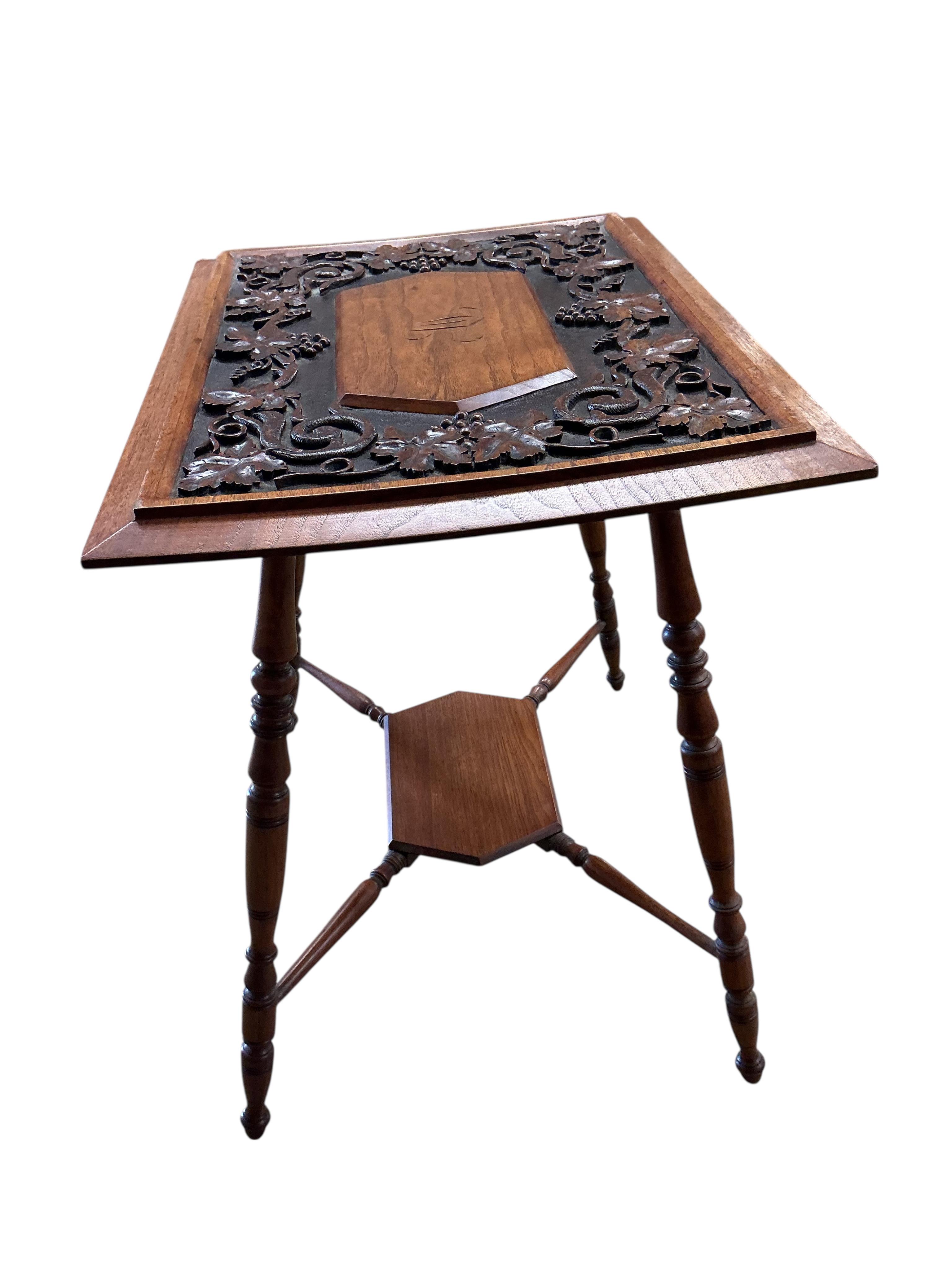 A late Victorian rectangular carved oak occasional table, decorated with vines, width 66cm, depth 49cm, height 67cm
